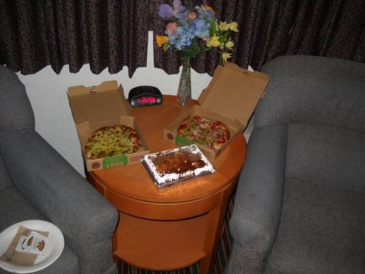 Two large comfortable chairs sit in front of the window (with nice dark drapes). It's a great place to sit down and have a bit of dinner!