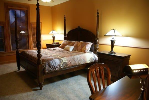 Charles' room features a king bed and maple trim made on the premises.