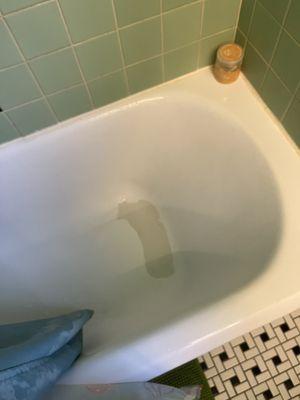 A failing bathtub finish done by Bath Refinishing Solutions because they did not properly sand the prior finish down. Boooo!