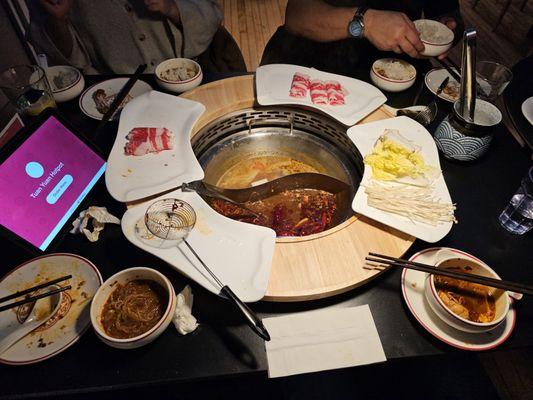 Hotpot table with each of the offered broths.