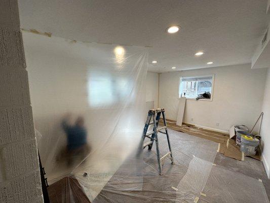 Drywall being installed, careful protective masking placed everywhere even though we said the carpet would be replaced.