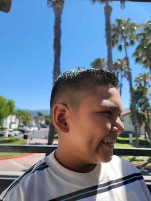 Happy with his clean fade.