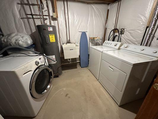 Before picture. he was to take the 2 on the right and replace and hook up washer on left which was used days before and in working condition