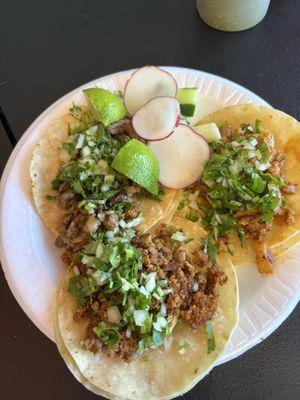 One taco Al pastor, one carne asada, and one choripollo (sausage and chicken).