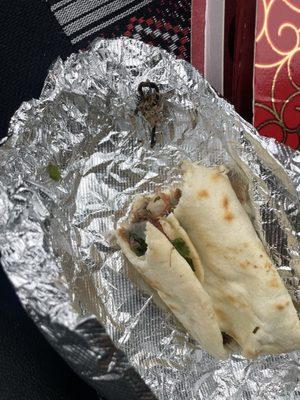 Barbacoa taco with onion and cilantro