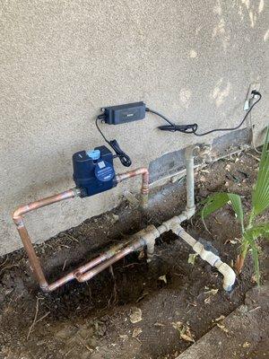 Installation of a Moen Flo valve and retrofit of the water lines, to accommodate the Moen Flo installation.