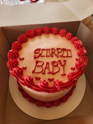 This is the cake they gave me. It's not centered, the hand writing is poorly done and they added some poorly drawn mini hearts.