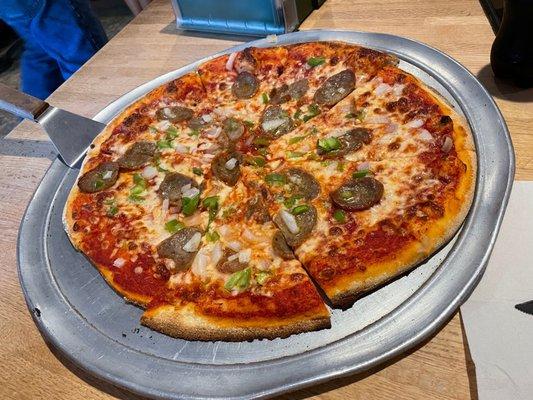 Large pie with sausage, peppers and onion