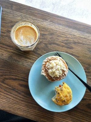Traditional cappuccino with cinnamon, pumpkin spice muffin and sausage egg quiche