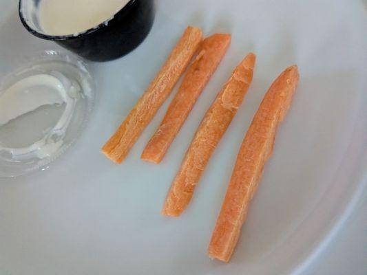 These are the unpeeled four carrot sticks provided for takeout on an order of garlic parm wings that weren't garlic parm wings