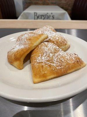 Fresh made Beignets! Little French pillow donuts. Plain, Nutella or triple berry filled.