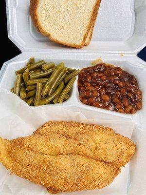 Delicious fried fish dinner with green beans and baked beans.
