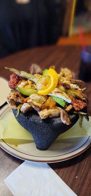 Seafood Molcajete mix. Comes with fish, shrimp, grilled chicken, chorizo, cubed cheese, nopales (cactus) and green onio a must share