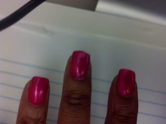 Nails filed unevenly. Polish smudged they werent dry. Filed natural nail down to nothing. Drill lines present on sight.