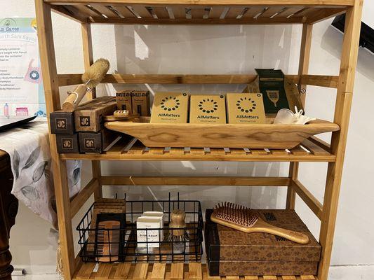 Eco-friendly Products available at Sam Saves. In this image you can see a bottle brush, menstrual cups, bamboo hair brush and much more.