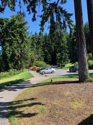 Parking lot past the restroom building.
