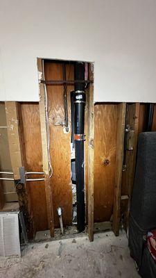 New water drain pipe installed, in preparation for structure repair.