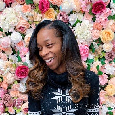 Traditional sew-in with subtle highlights.