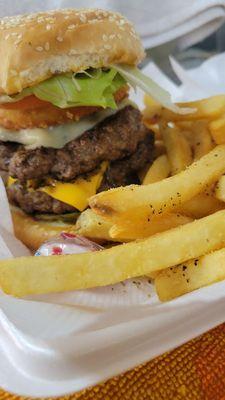 1/2 lb angus beef burger Lettuce tomato onion pickles Optional cheese Toasted bun Parm fries