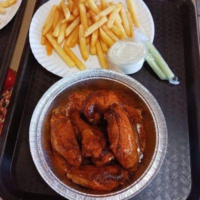 Honey Old Bay chicken wings and fries.
