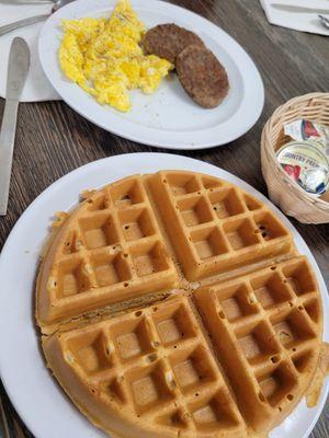 Waffle, scrambled eggs, and sausage patties