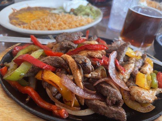 Chicken and Steak Fajitas (with rice, beans, pico de gallo, guacamole and sour cream)