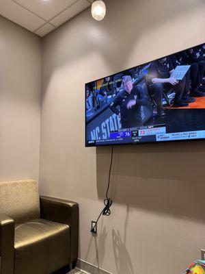 TV area with 4 chairs.