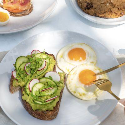 Avocado toast with pasture-raised eggs - a clean, healthy all-day breakfast option.