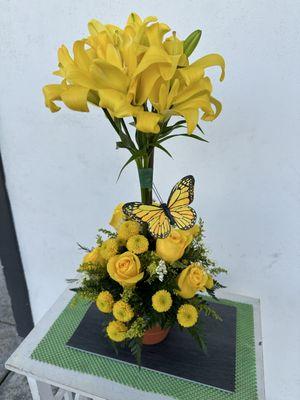 Yellow lilies roses cushion pompom and a butterfly