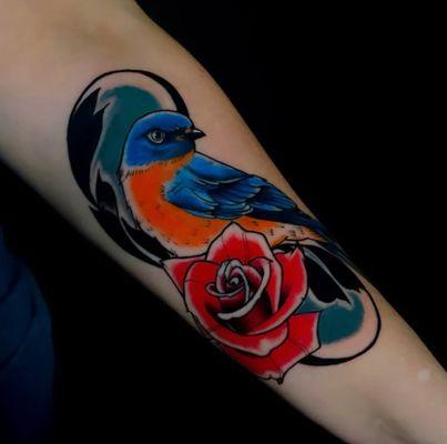Color bird tattoo on forearm by Xander @xandercardon
