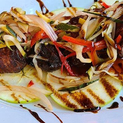 A close-up of the Bacon on Bacon appetizer displays in a colorful way the wonderful taste of this dish.