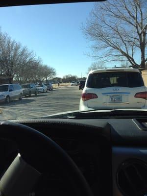 Waiting to retrieve my daughter!  Long line as usual.