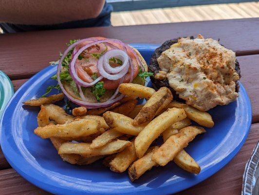 Burger with crab dip on top and side of fries