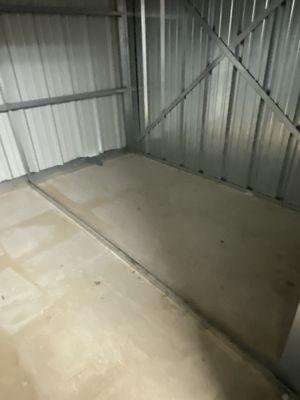 You can see the marks where boxes were kept (the entire place had this orangey dirt you see here).