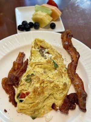 Breakfast with hubs. Fresh veggie omelet and fruit.