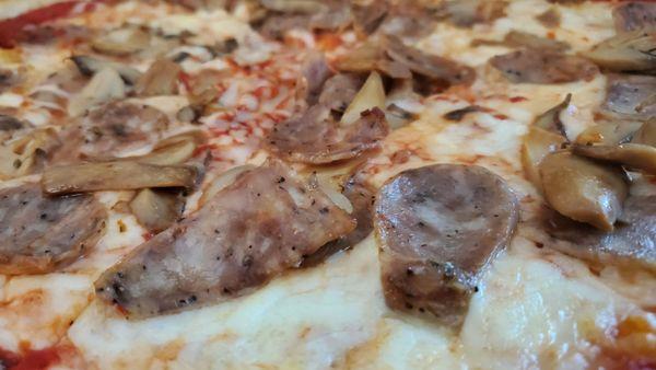 Medium sausage and mushroom pizza.