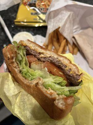 Cheeseburger with everything (grilled onions).