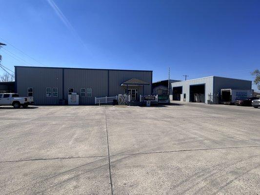 View of our lumberyard in Cut Off, LA with roofing and building supplies - Dufrene Building Materials