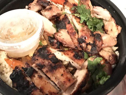 Grilled chicken, great flavor, slightly dry. Rice & veggies are great.