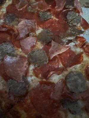 Pepperoni sausage and Canadian bacon -- the sausage is disgusting. Who slices sausage in pizza? Lazy pizzeria's...