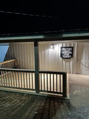 Picture of the front door and covered smoking area!
