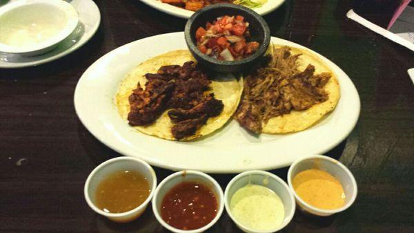 Marinated pork taco (tasted delicious with their spicy lime sauce) and Carnitas taco (i added red tomatillo sauce)