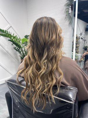 Hair extensions by KP Roman.