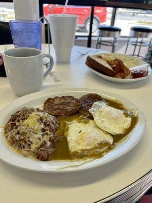 Huevous Rancheros #4 and in the background is a standard breakfast.