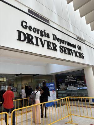 Inside South DeKalb Mall-line is out the door on a Tuesday morning.