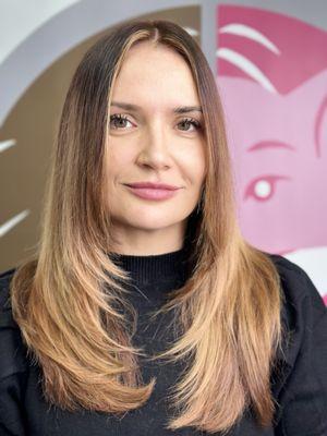 Long, subtle face framing layers. Color melted to refresh her base but keep her ends light and bright.