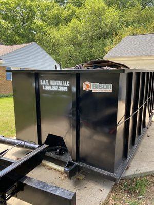 20 cubic yard dumpster being picked up from site.
