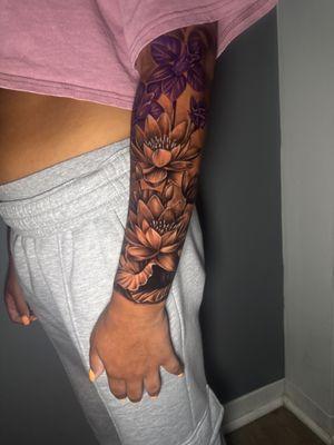 July Leo Birth flowers tattoo done by tattoo artist Drew