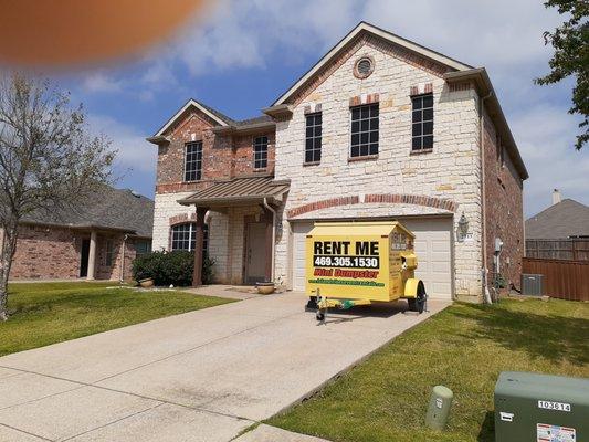 Dumpster in front of client's home in Prosper, Texas