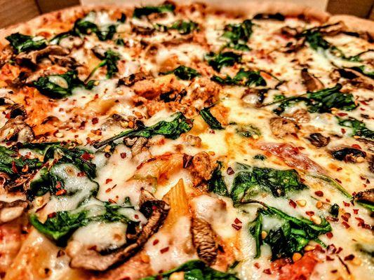 Large Baked Ziti pizza with mushrooms and spinach.